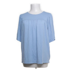 Next | Lichtblauwe losse blouse