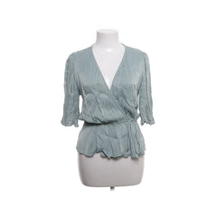 Pigalle | Lichtblauwe Wikkel Blouse