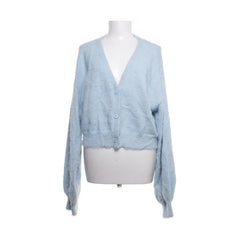 NA-KD | Lichtblauwe fluffy cardigan met knopen.