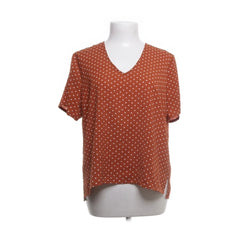 Soaked in Luxury | Roestbruine polkadot blouse