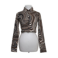Motel | Zwart-wit swirl cropped blouse